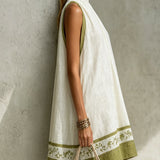 Agathe | Mini Trapeze Dress in White and Olive Green Floral Print